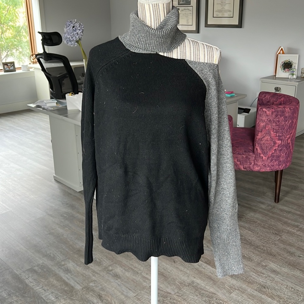 Jamison black and gray cutout turtleneck sweater.